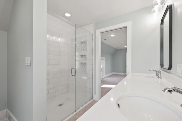 bathroom with vanity and an enclosed shower