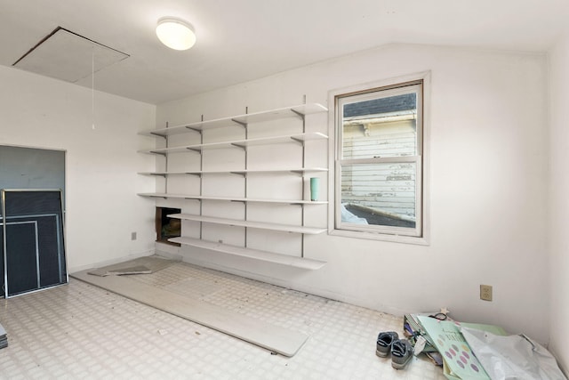 unfurnished living room with lofted ceiling