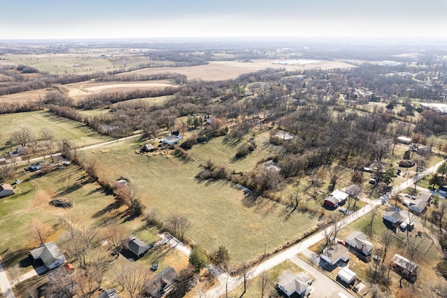 birds eye view of property featuring a rural view