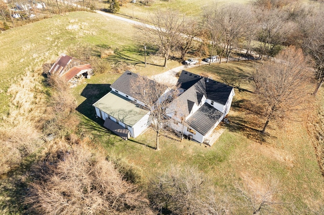 birds eye view of property with a rural view