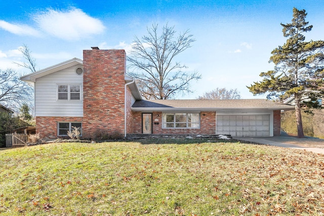 tri-level home with a front lawn and a garage