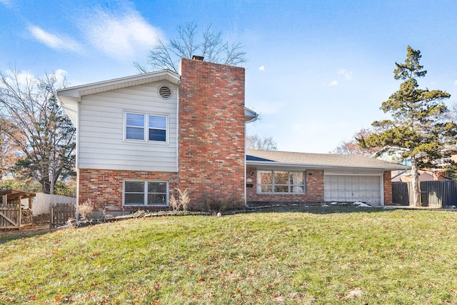 view of front of house featuring a garage and a front yard