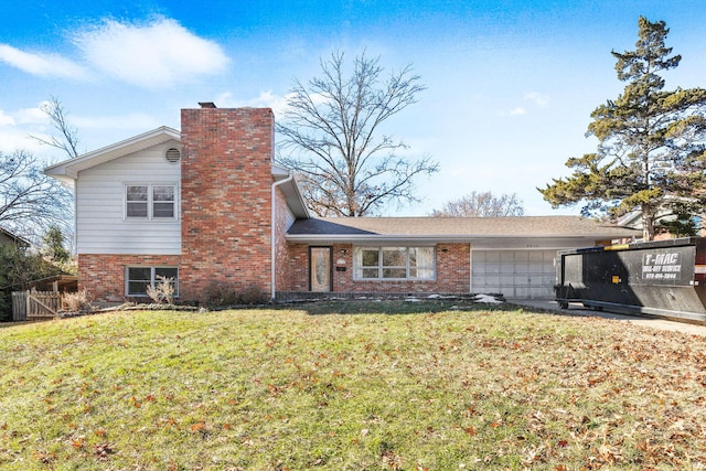 view of front of home featuring a garage and a front yard