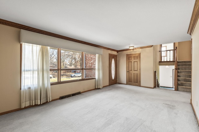 unfurnished living room featuring light colored carpet and crown molding