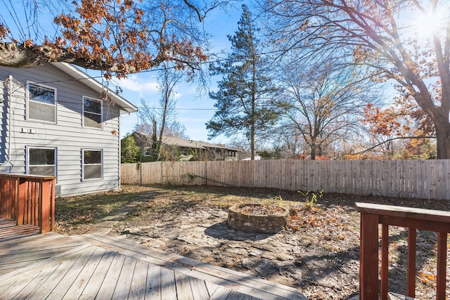 deck featuring an outdoor fire pit