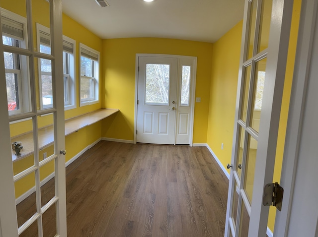 entryway featuring hardwood / wood-style floors and french doors