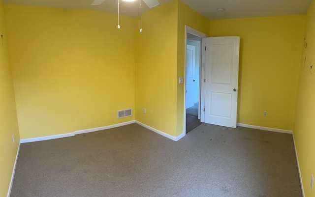 spare room featuring carpet flooring and ceiling fan