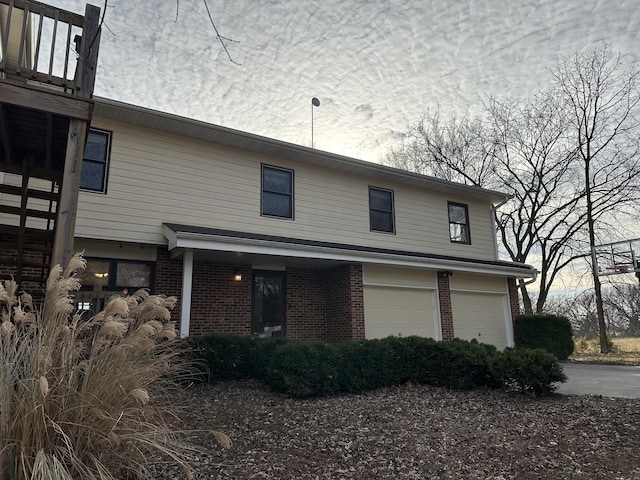 view of side of home with a garage