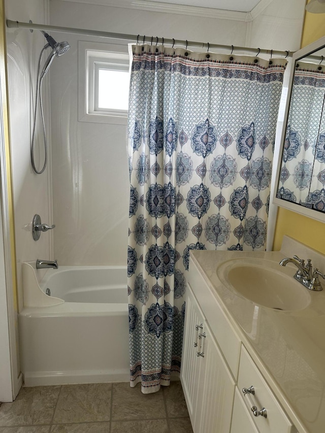 bathroom featuring tile patterned floors, crown molding, shower / bath combo with shower curtain, and vanity