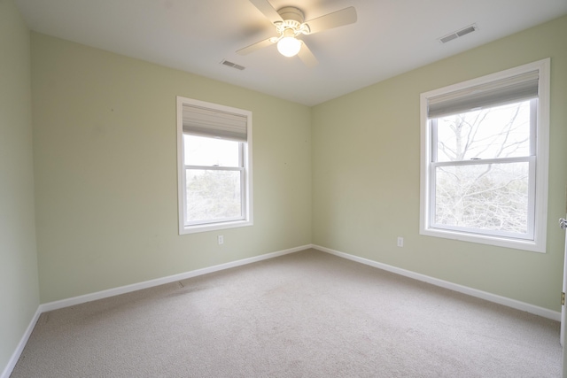 12500 W Rocheport Gravel Rd, Rocheport, MO 65279 - carpeted spare room with a ceiling fan, visible vents, and baseboards
