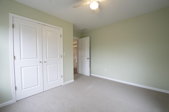 12500 W Rocheport Gravel Rd, Rocheport, MO 65279 - unfurnished bedroom featuring a closet, carpet flooring, ceiling fan, and baseboards