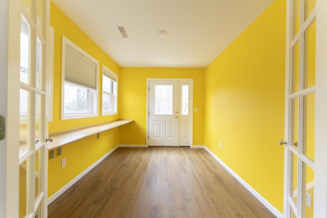 12500 W Rocheport Gravel Rd, Rocheport, MO 65279 - entryway with visible vents, baseboards, and wood finished floors