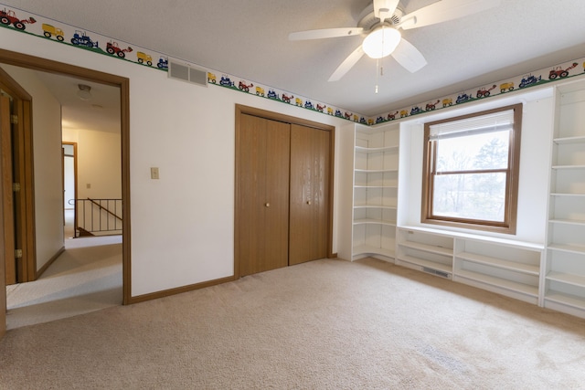12500 W Rocheport Gravel Rd, Rocheport, MO 65279 - unfurnished bedroom with baseboards, visible vents, a closet, and light carpet