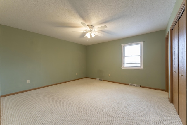 12500 W Rocheport Gravel Rd, Rocheport, MO 65279 - unfurnished bedroom with a closet, visible vents, and light colored carpet
