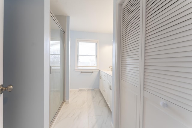 12500 W Rocheport Gravel Rd, Rocheport, MO 65279 - bathroom featuring a shower with door, a closet, marble finish floor, and vanity