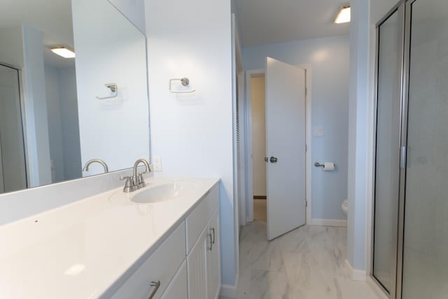 12500 W Rocheport Gravel Rd, Rocheport, MO 65279 - bathroom with toilet, marble finish floor, a shower stall, baseboards, and vanity