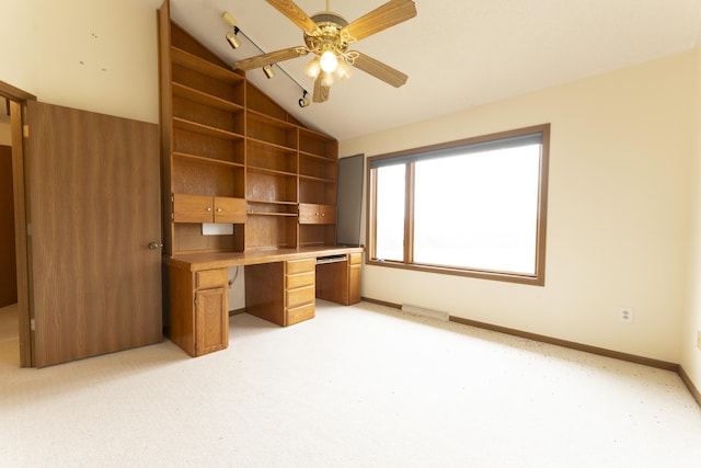 12500 W Rocheport Gravel Rd, Rocheport, MO 65279 - unfurnished office with a ceiling fan, baseboards, light colored carpet, vaulted ceiling, and built in study area