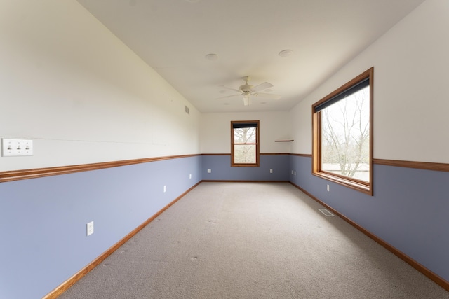 12500 W Rocheport Gravel Rd, Rocheport, MO 65279 - carpeted spare room featuring visible vents, a ceiling fan, and baseboards