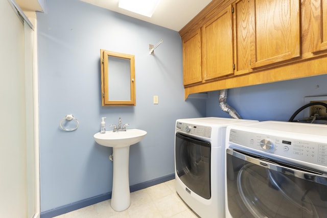 12500 W Rocheport Gravel Rd, Rocheport, MO 65279 - washroom featuring baseboards, cabinet space, and washing machine and clothes dryer