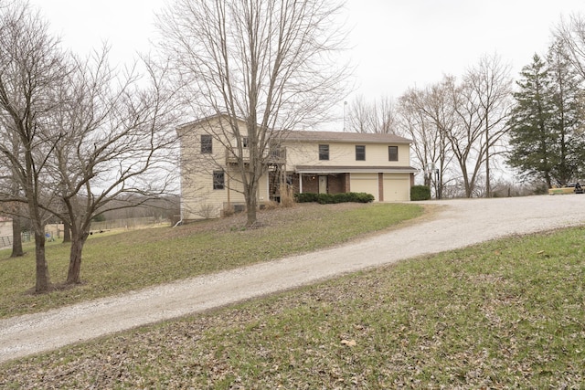 12500 W Rocheport Gravel Rd, Rocheport, MO 65279 - traditional-style house featuring a front lawn, a garage, and dirt driveway
