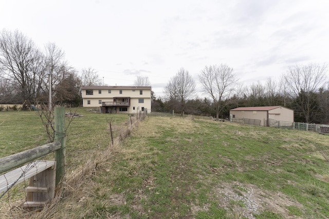 12500 W Rocheport Gravel Rd, Rocheport, MO 65279 - view of yard with a wooden deck, an outbuilding, an outdoor structure, and fence
