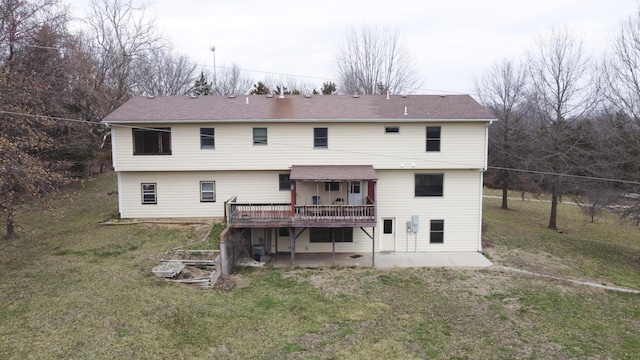 12500 W Rocheport Gravel Rd, Rocheport, MO 65279 - rear view of house with a patio, a lawn, and a deck