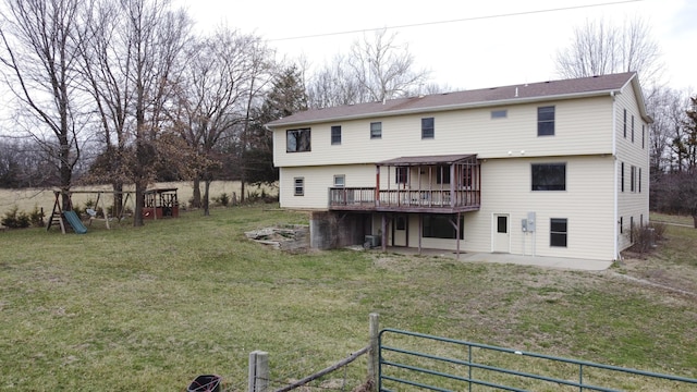 12500 W Rocheport Gravel Rd, Rocheport, MO 65279 - rear view of property with a deck, a playground, a yard, and central AC