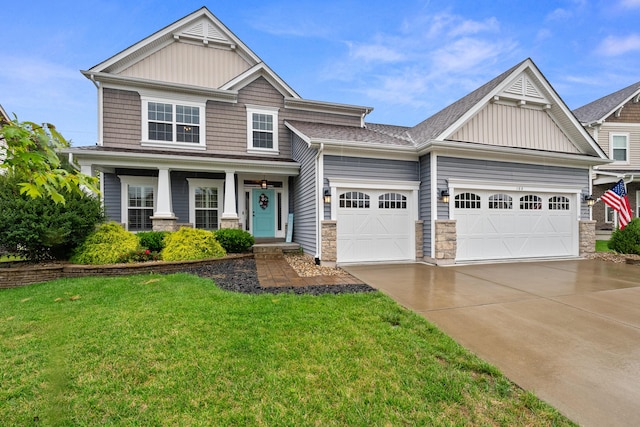 craftsman-style home featuring a garage, a front yard, and a porch