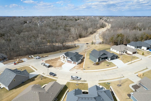 aerial view with a residential view and a view of trees