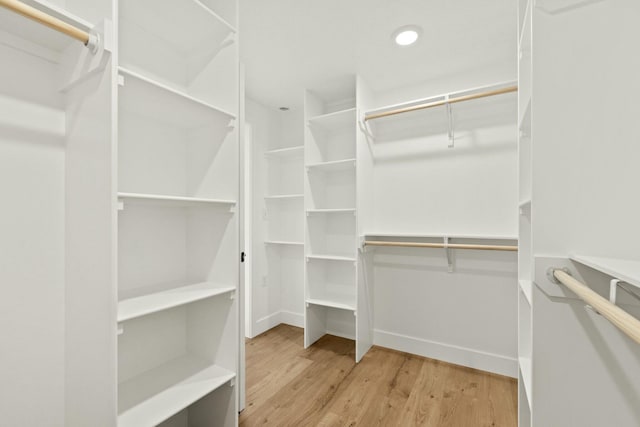 spacious closet with wood finished floors