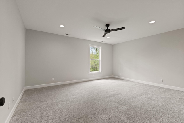 unfurnished room featuring carpet flooring, a ceiling fan, baseboards, and recessed lighting