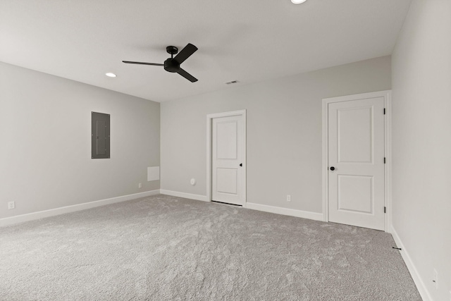 unfurnished room featuring electric panel, a ceiling fan, visible vents, carpet flooring, and recessed lighting