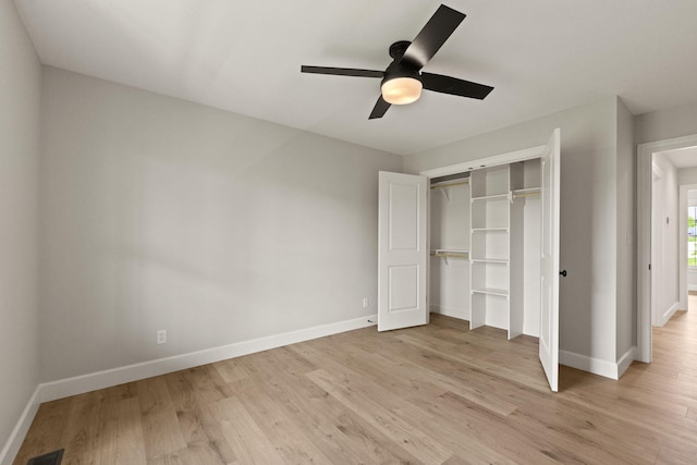 unfurnished bedroom with a ceiling fan, visible vents, baseboards, a closet, and light wood finished floors