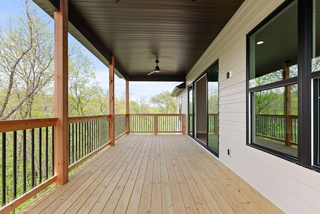 wooden terrace featuring ceiling fan