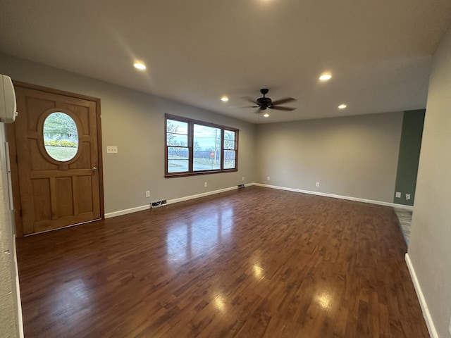 foyer featuring plenty of natural light, dark hardwood / wood-style floors, and ceiling fan