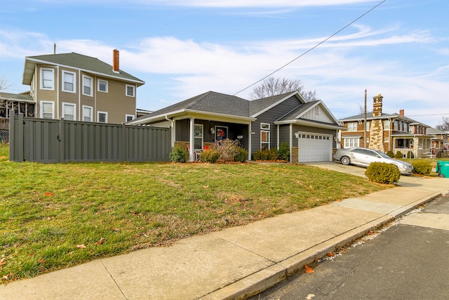 view of front of house featuring a front yard and a garage