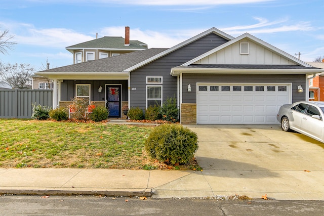 view of front facade featuring a garage and a front lawn