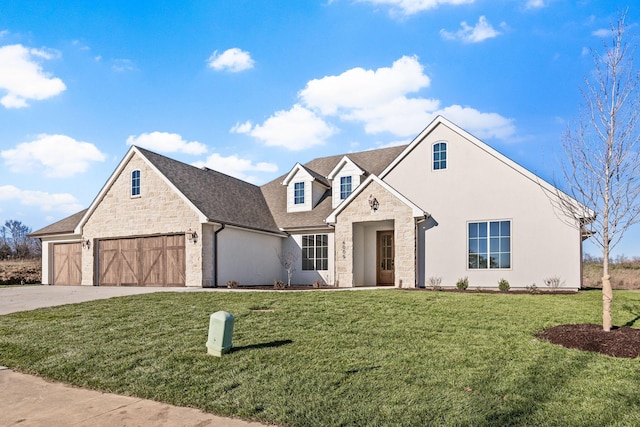 view of front of home featuring a front yard and a garage