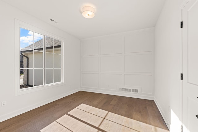 unfurnished room featuring wood-type flooring