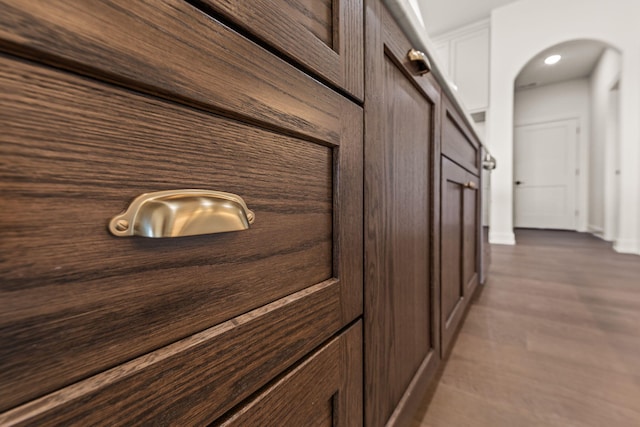 hallway with hardwood / wood-style flooring