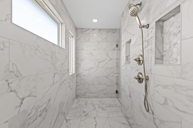 bathroom with tiled shower