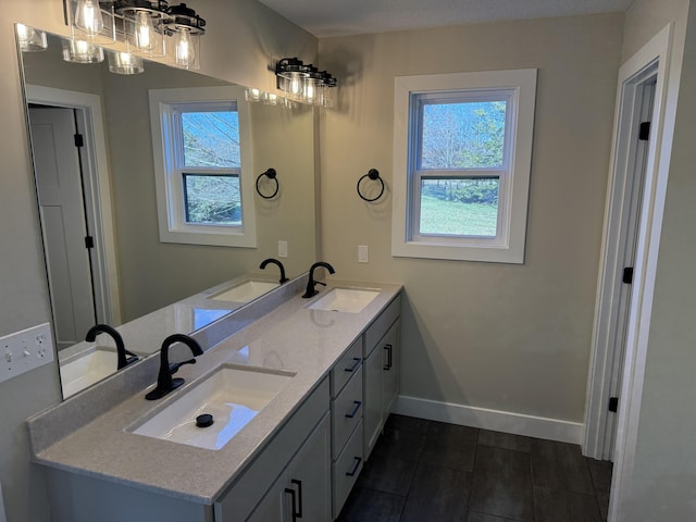 bathroom featuring a wealth of natural light and vanity