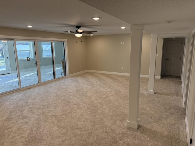 unfurnished living room featuring light carpet and ceiling fan