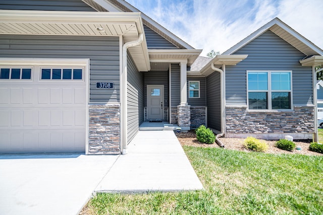 doorway to property with a garage