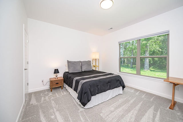 bedroom with light carpet