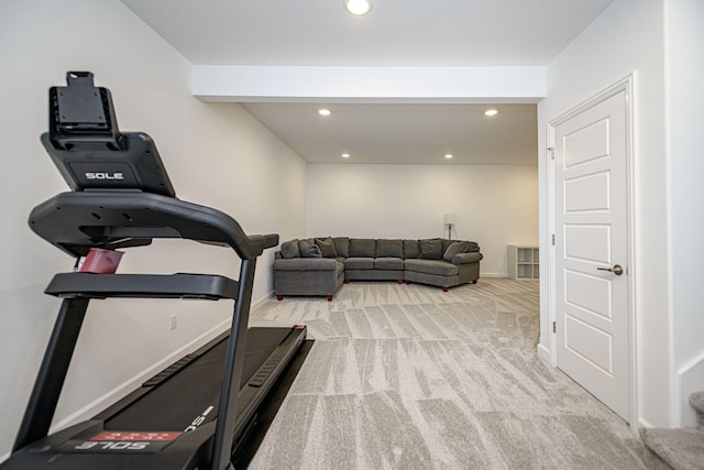 workout area featuring light colored carpet