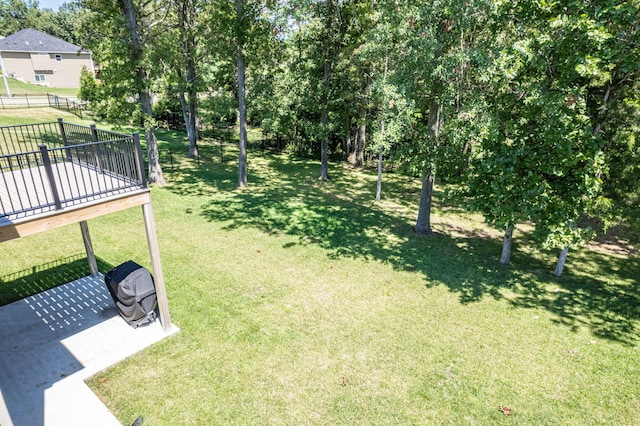 view of yard featuring a wooden deck