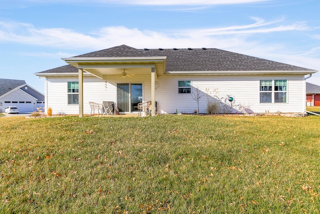 rear view of house with a lawn, ceiling fan, and a patio area