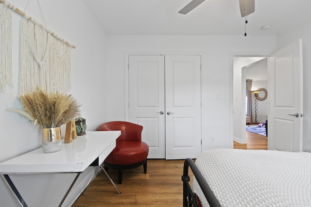 bedroom with hardwood / wood-style floors, a closet, and ceiling fan