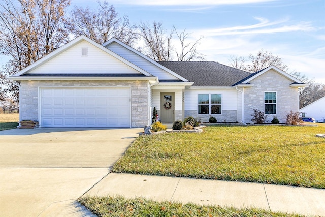 single story home featuring a garage and a front lawn